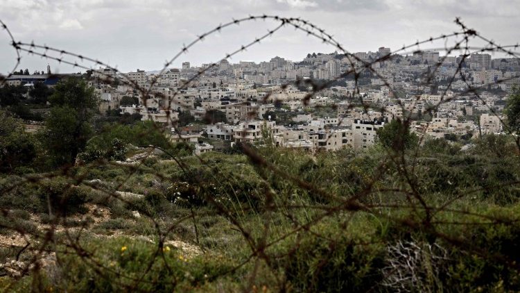 Bethlehem seen behind barbed wire from the Israeli settlement of Gilo