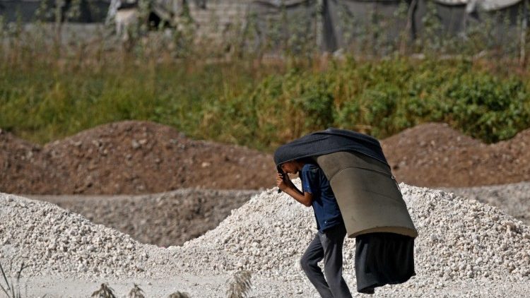 A displaced Syrian flees conflict in his country