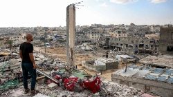 A man views a destroyed Khan Yunis, in the southern Gaza Strip, on October 7, 2024 