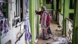 Bukavu: Josephine Ntububa, 69 inspects her once thriving market shop now damaged.