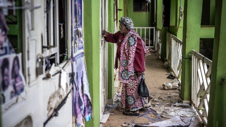 Bukavu: Josephine Ntububa, 69 inspects her once thriving market shop now damaged.