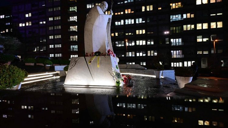 A picture shows the statue of John Paul II outside the Gemelli hospital where Pope Francis is hospitalised, February 24th