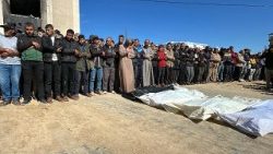 Palestinians mourn during the funeral of loved ones killed in Israeli strikes in Khan Yunis in the southern Gaza Strip on 23 March
