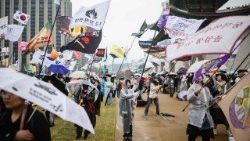 Anti-Yoon protesters wave flags during a rally outside Gyeongbokgung Palace in Seoul on April 5, 2025,