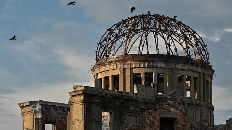 Crows fly around the top of the Atomic Bomb Dome on the eve of the 80th anniversary of the world's first atomic bomb attack, in the city of Hiroshima on August 5, 2025