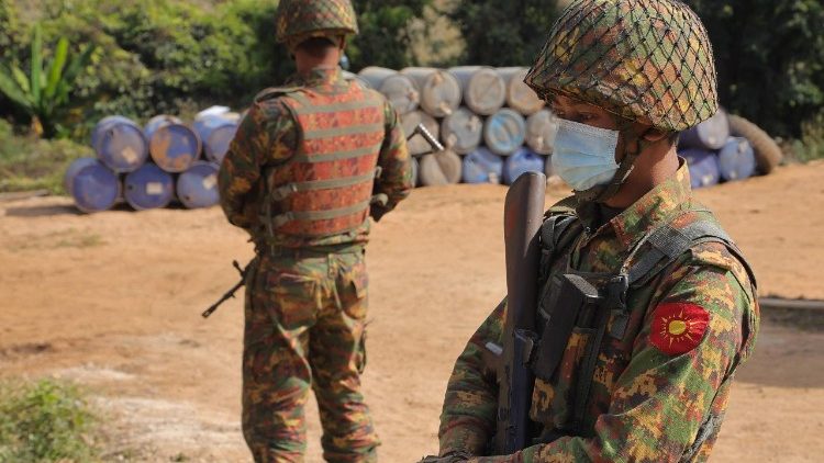 Myanmar soldiers guard a captured methamphetamine lab near Namlan in Shan State