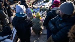 People gather during a vigil held by healthcare workers at a memorial for Alex Pretti on January 25, 2026 in Minneapolis, Minnesota