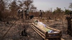  The body of a victim lies on a wooden stretcher following the attack in Woro, Kwara State, on February 5.