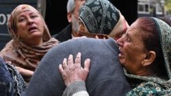 people mourn the death of their relatives following the suicide bombing at the Islamabad mosque