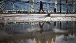 A person walks alongside the Wall of Remembrance of the Fallen for Ukraine in Kyiv