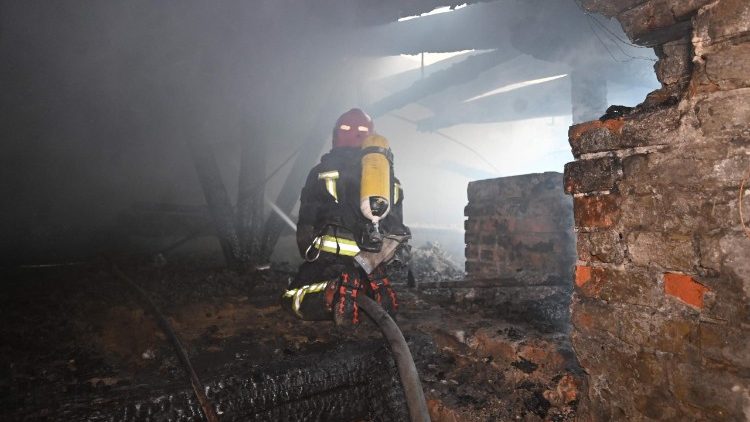 A firefighter puts out a fire in the damaged Kharkiv Art Museum following a drone strike in Kharkiv on June 14, 2026, amid the Russian invasion of Ukraine. (Photo by SERGEY BOBOK / AFP)