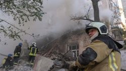 Rescuers work at the site of drone attack in downtown Kyiv
