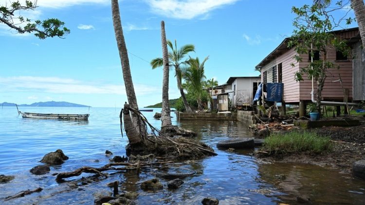 Houses impacted by rising sea levels in Fiji