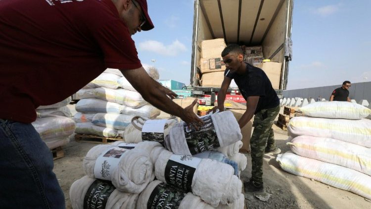 Humanitarian aid bound for Palestinians in Gaza passes through Rafah crossing