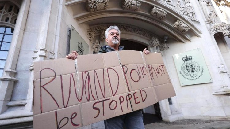 A demonstrator protesting against the government's Rwanda policy outside the UK's Supreme Court