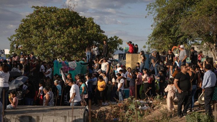 Relatives and neigbours of the deceased take part in the funeral