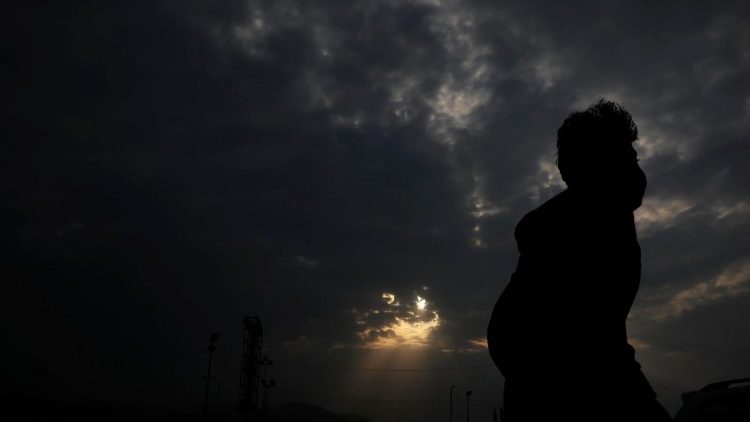 Sunset light breaks through clouds in Sana'a