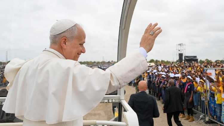 Pope Leo greeting the faithful from his popemobile