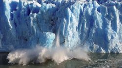 Splinters of ice peel off from one of the sides of the Perito Moreno glacier inb Patagonia, southern Argentina