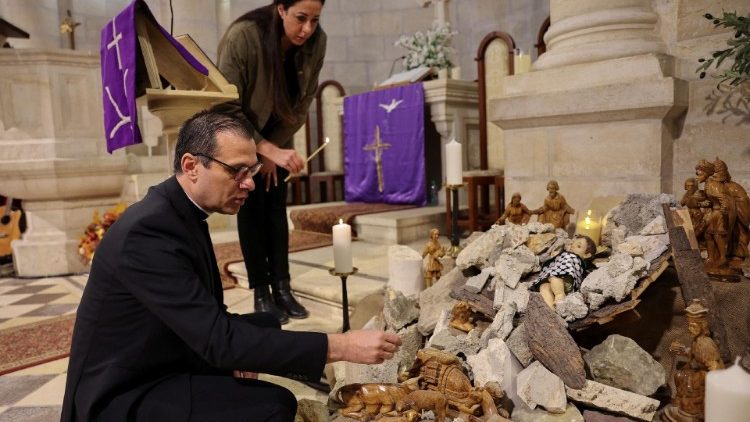 Bethlehem: Munther Isaac prepares a nativity scene depicting the baby Jesus amidst rubble