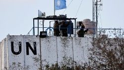 United Nations peacekeepers (UNIFIL) look at the Lebanese-Israeli border