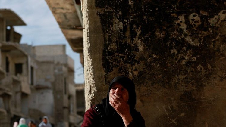 A woman reacts at the al-Yarmouk Palestinian refugee camp in Damascus, Syria