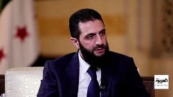 Syria's de facto leader Ahmed al-Sharaa, also known as Abu Mohammed al-Golani, speaks during an interview, in Damascus