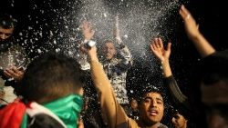 Palestinians react to news on a ceasefire deal with Israel, in Khan Younis in the southern Gaza Strip
