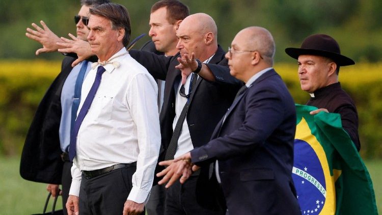 FILE PHOTO: Brazil's President Jair Bolsonaro looks on as he meets with supporters in Brasilia, Brazil, in December 2022