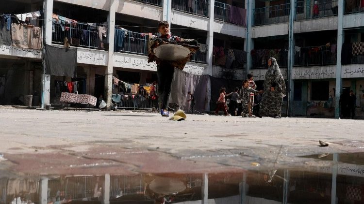 Displaced Palestinians shelter at a school in Khan Younis