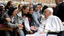 Pope Francis meets with people as he unexpectedly appears during the Palm Sunday Mass in Saint Peter's Square at the Vatican