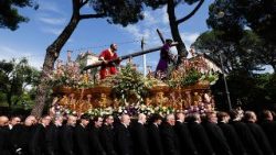 Pilgrims march near the Colosseum carrying revered statues from Europe's confraternities, during the Grande Processione, in Rome