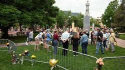 People pray near the scene of the attack in Boulder, Colorado, USA.