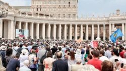 Pope Leo XIV leads the Angelus prayer from his window at the Vatican