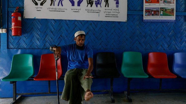 Shofiul Islam, 35, who has disabilities, shows his leg while visiting a facility funded by USAID, for treatment, at the Rohingya refugee camp, in Cox's Bazar