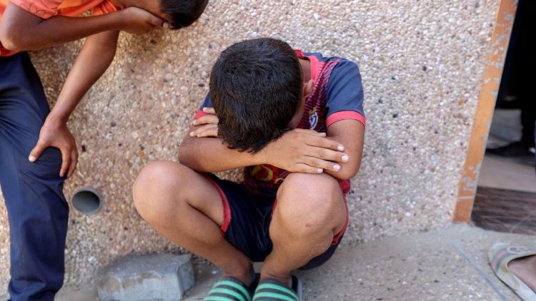 Palestinians mourn loved ones killed in Israeli fire while seeking aid, at Nasser Hospital in Khan Younis, southern Gaza Strip