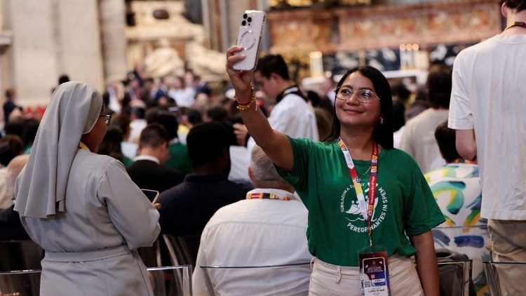 A person takes pictures inside the St. Peter's Basilica during Jubilee of Youth, at the Vatican