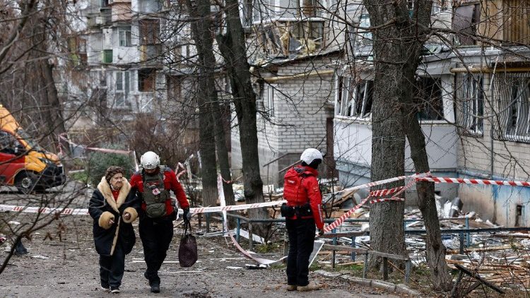 FILE PHOTO: Emergency responders work at the site of a Russian drone strike on an apartment building, in Kyiv