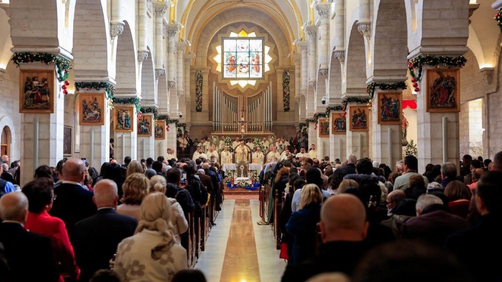 Christian worshippers attend Christmas morning Mass at the Nativity Church