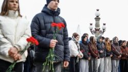 People gather to mark the fourth anniversary of the full-scale Russian invasion in Irpin