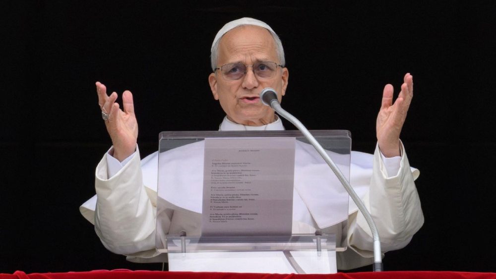 Pope Leo XIV leads the Angelus prayer from a window of the Apostolic Palace, at the Vatican