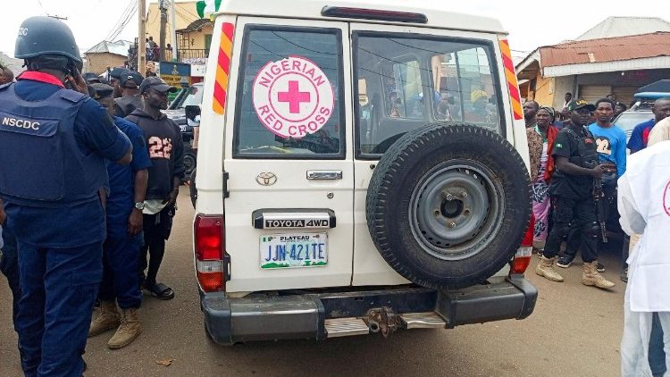 A Nigerian Red Cross vehicle arrives at the scene of an attack, the morning after gunmen killed multiple people in an overnight attack in Angwan Rukuba