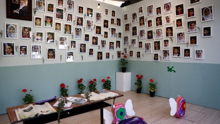 Pictures of the Minab School students who were killed in a strike, are displayed during a ceremony, in Tehran
