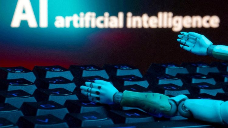 FILE PHOTO: Illustration shows message reading "AI artificial intelligence," keyboard and robot hands