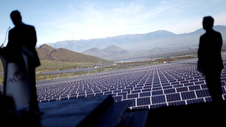 FILE PHOTO: Atlas Renewable Energy's Chile General Manager Alfredo Solar (L) delivers a speech during the opening ceremony of Quilapilun solar plant on the outskirts of Santiago