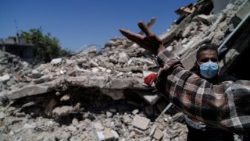 A rescuer at the site of an Israeli airstrike on a house in Barish, in Tyre district, Lebanon