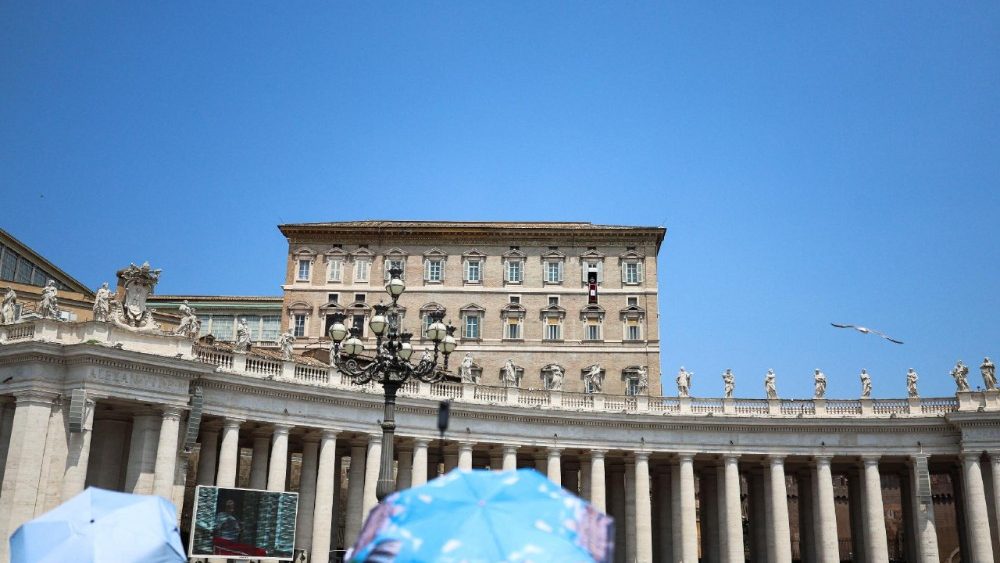 Faithful shield themselves with umbrellas amid a heatwave as they wait for Pope Leo to lead the Angelus prayer from a window of the Apostolic Palace