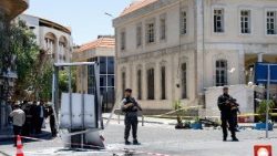 Explosive devices blow up near a hotel where French President Emmanuel Macron was meant to be staying, in Damascus