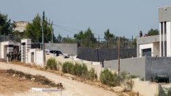 International convoy delivers aid to Palestinian families after Israeli army checks them, on the outskirts of Qusra village in the West Bank