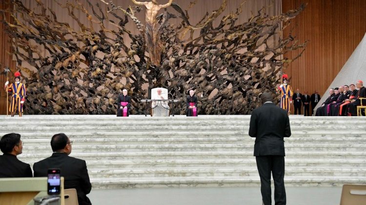 Pope Francis listens to a questions by a seminarian during the meeting with seminarians and priests studying in Rome